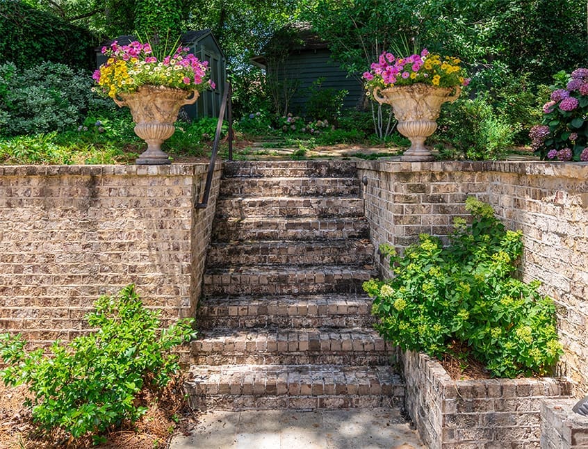 How to use plants as tools, showcasing a beautiful backyard that does it all, and discussing Zinnia plants. A newsletter presented by R&R Landscaping.