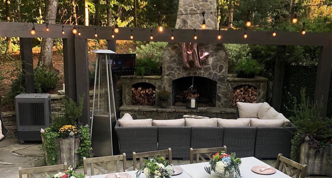 A beautiful backyard landscaping project at dusk with perfect lighting, designed and built by R&R Landscaping.